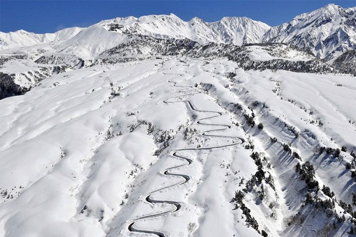 Aerial view of the Tateyama Kurobe Alpine Route forming a beautiful curve