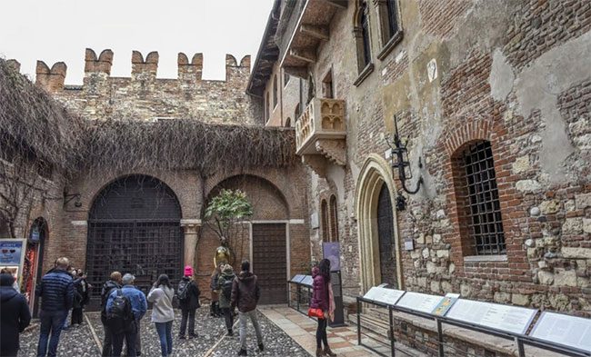 Tourists visiting a square in Verona, Italy,