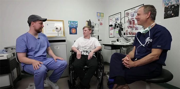 MrBeast talking to a visually impaired patient after surgery.