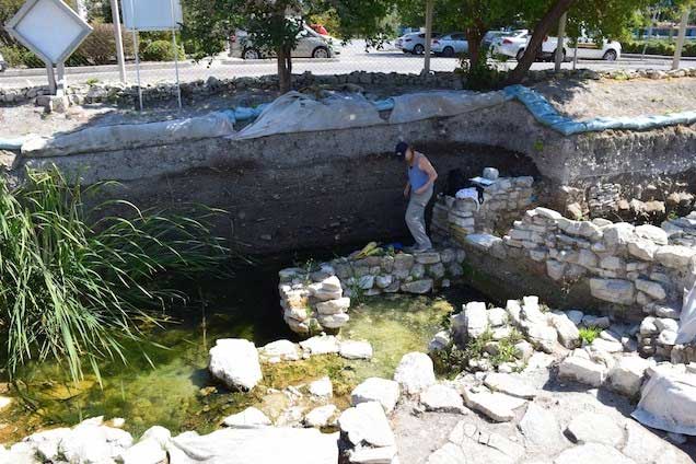 Beverly Goodman-Tchernov examining a layer of ash at a site from the Bronze Age
