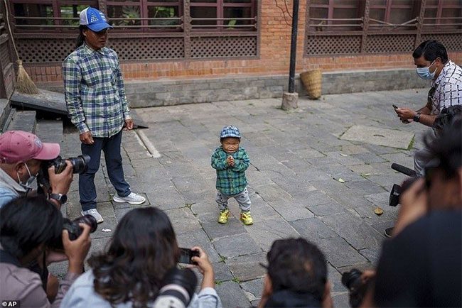 The young man was photographed and interviewed by numerous photographers and media present at the ceremony.
