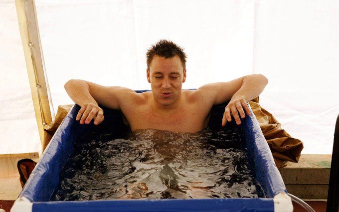 Former England player John Terry soaking in an ice bath after injury.