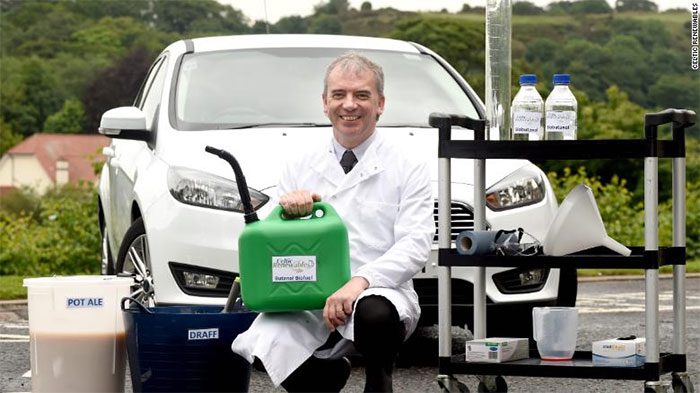 Scientist Martin Tangney with biofuel produced from whisky.