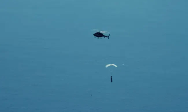 The helicopter is equipped with an additional fuel tank to extend its range.