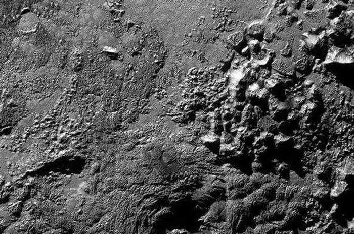 Pluto's surface features ice volcanoes.