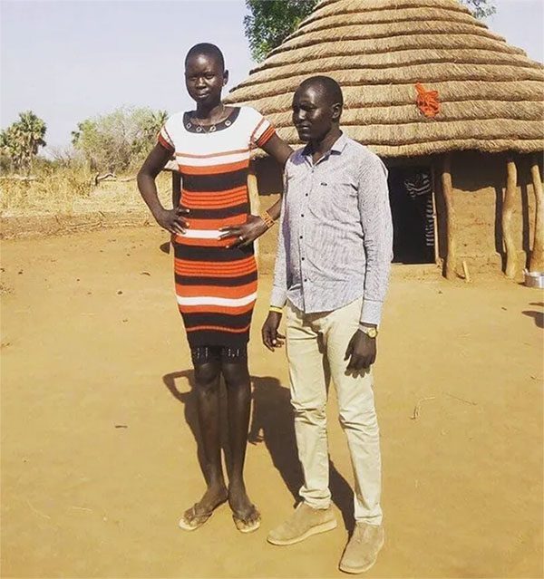 The Dinka tribe traditionally lives in round clay huts with thatched roofs.