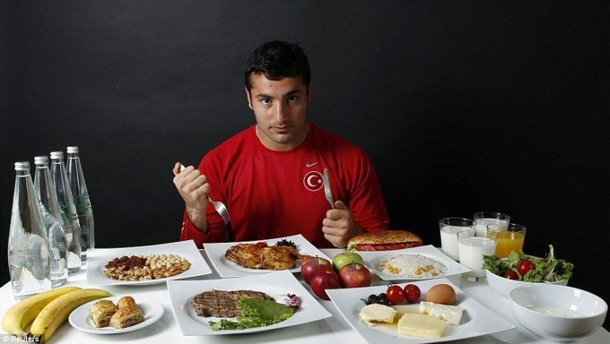 An individual athlete needs to consume between 6,000 to 8,000 calories per day.