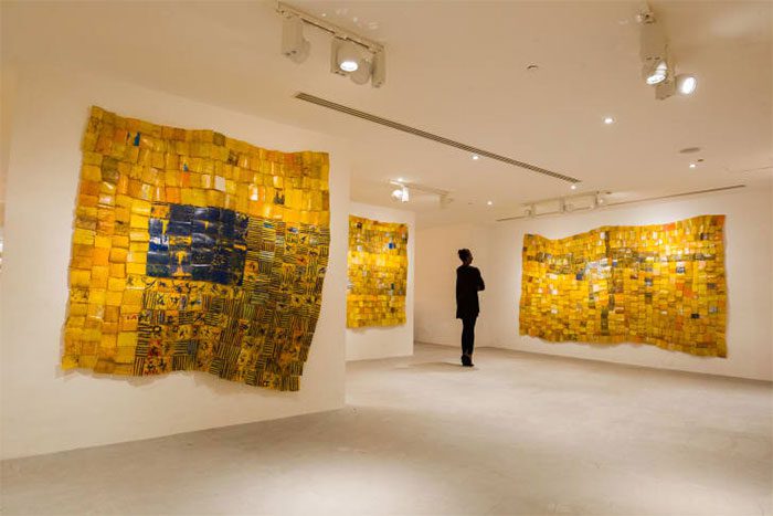 Bright yellow walls made from Gallons.