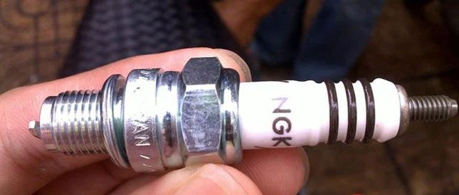 Signs of a faulty spark plug include excessive black smoke, difficulty starting...