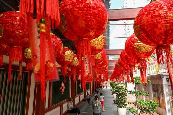 Hanging lanterns for Lunar New Year at a temple in Singapore on January 31, 2022.