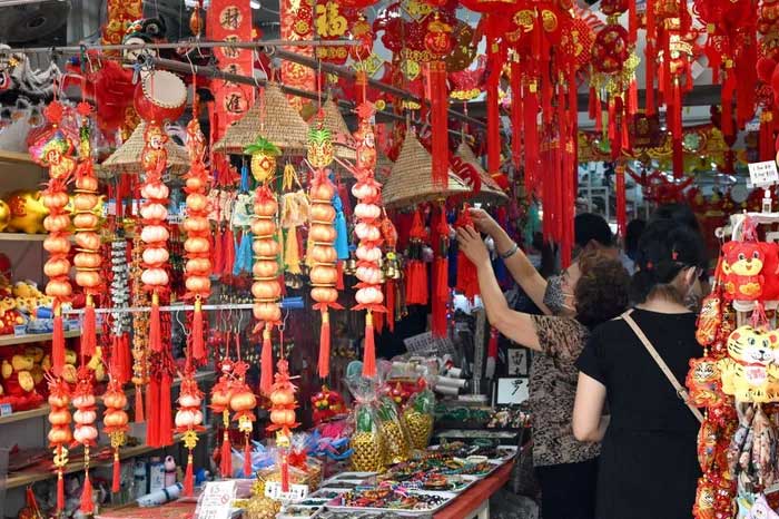 Shoppers buying Lunar New Year decorations in Singapore on January 31, 2022.