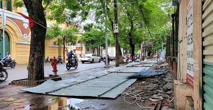 The metal fence of Hong Bang Secondary School was blown down during the storm.