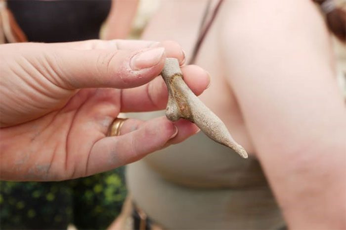 Some artifacts sculpted in the shape of feet, hands, and ears in miniature bronze