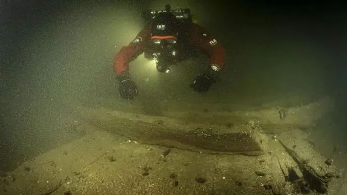 A diver approaching the ghost ship
