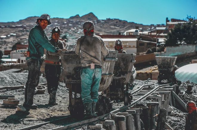 Miners extracting ore at Cerro Rico.
