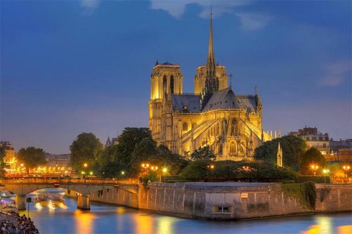 An ancient architectural structure standing majestically by the Seine River.