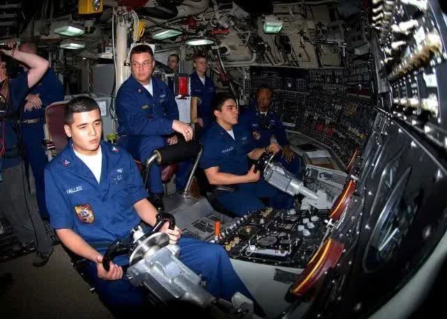 A working shift inside a submarine.