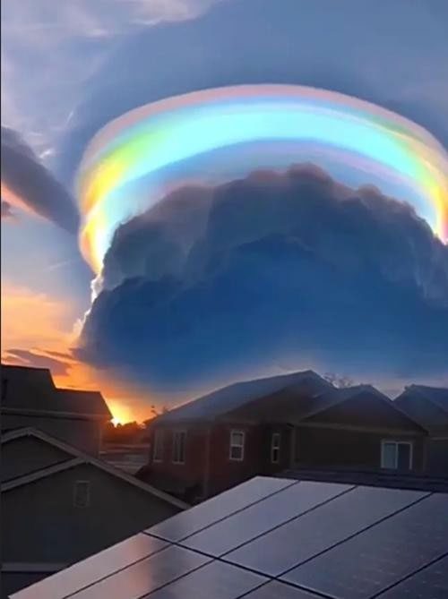 The beautiful rainbow ribbon, but beneath it is a dark cloud that looks very scary.