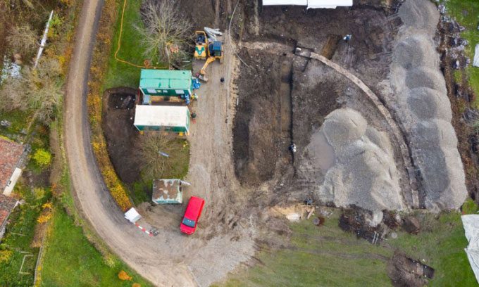About 1/4 of the oval arena's wall has been excavated.