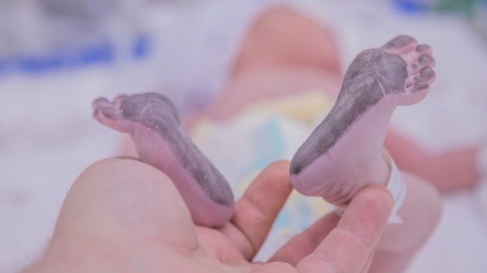 Since newborns are too small to sign their names like adults, taking their footprints serves as a form of identification.