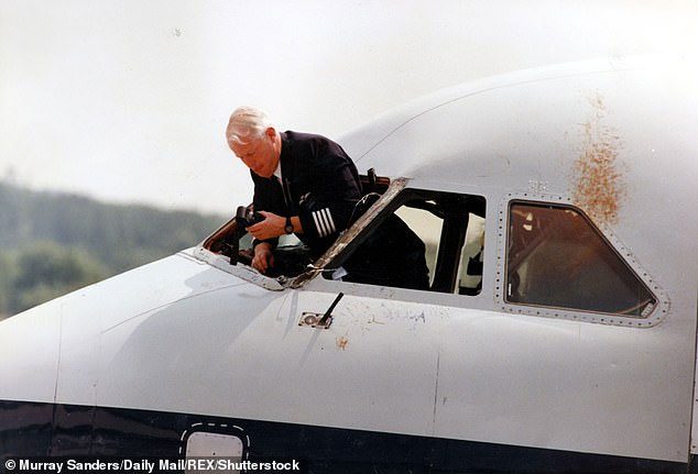 Investigator taking photos of the cockpit pressure explosion scene of the BAC 1–11–500.