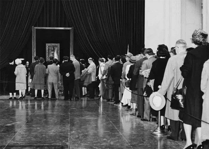 Waiting in line to see the Mona Lisa portrait by Leonardo da Vinci