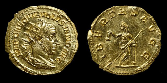 The Roman coin depicts Emperor Volusianus on one side and the goddess of freedom, Libertas, on the other.