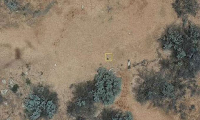 Drone image showing an area in the desert with the meteorite fragment marked