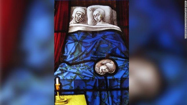 Image of a couple sleeping on the stained glass of a church.