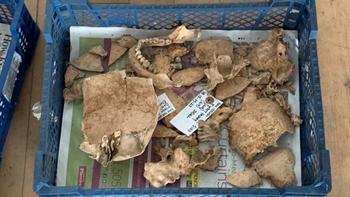Some remains show victims with head injuries before death.