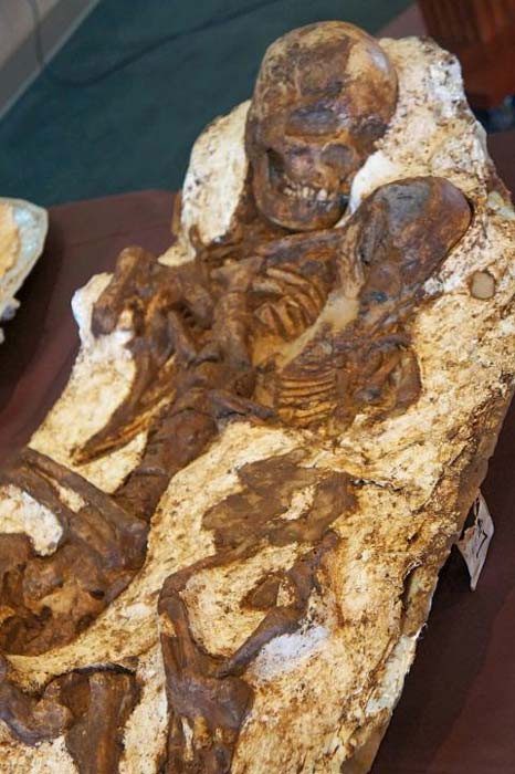 The skeleton of a young mother cradling her child