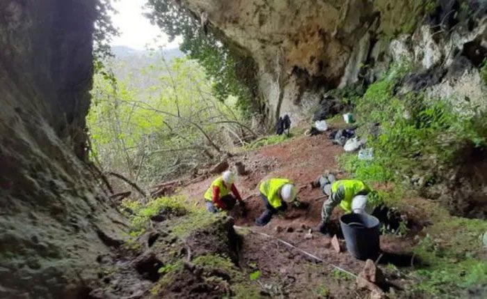 Archaeologists working in the cave.