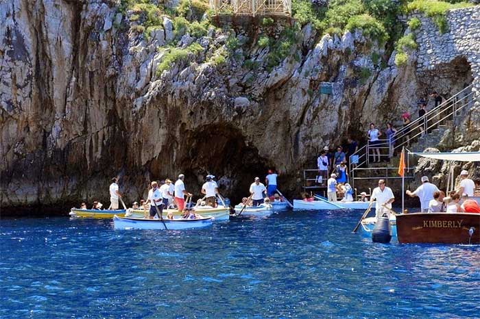 The entrance to the Blue Grotto is now bustling with tourist boats