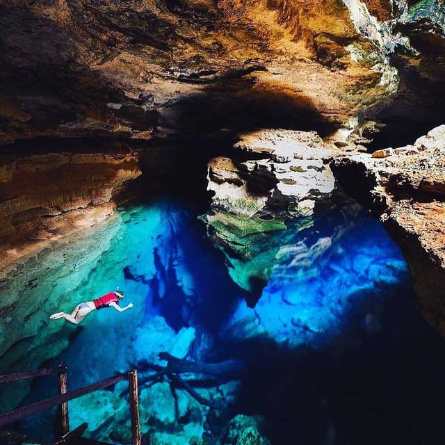 The invisible lake makes visitors feel like they are swimming in mid-air.