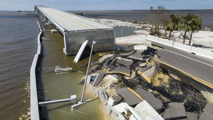 A damaged road on Sanibel Island, Florida due to Hurricane Ian.