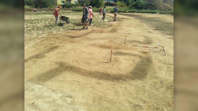 Excavation site with Stone Age remains appearing hazily after the foundation layer was removed