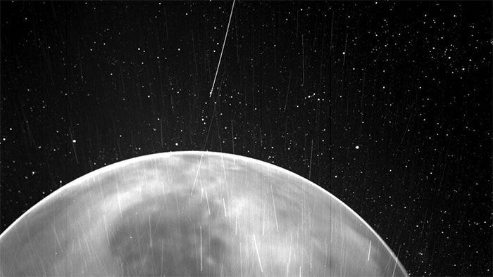 Bright streaks caused by charged particles and dust.