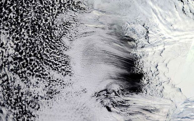 Parallel bands of cumulus clouds cover the Amundsen Sea off the coast of Antarctica