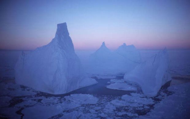 Aerial image capturing icebergs floating on the surface of the sea in Antarctica in 1997