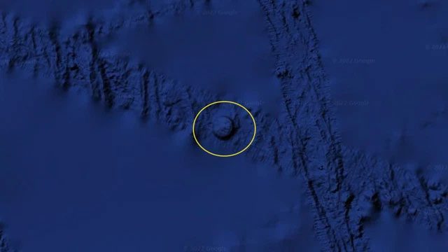The circle appears to rise from the ocean floor like a mountain.
