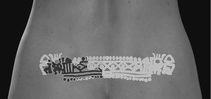 It took scientists a century to realize the strange skin pattern on the Egyptian girl's lower back was a tattoo