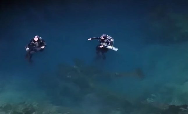 Divers discover many skeletons at the bottom of Lujia Lake.