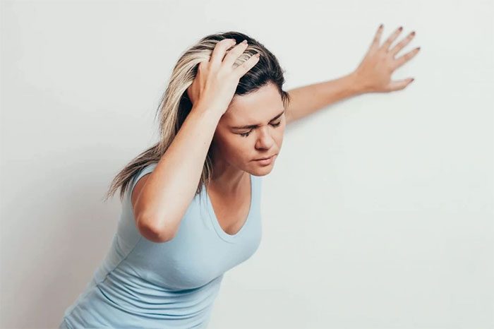 Dizziness and rapid heartbeat when standing up suddenly are common symptoms of POTS.