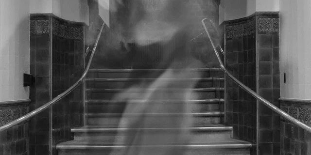 The shadow of a figure in a cloak wandering the corridors of the tower.