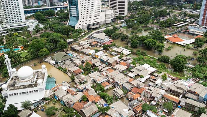 A flooded street in a poor neighborhood in downtown Jakarta, Indonesia