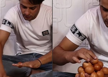 keep the month with 18 eggs on the hands of a man setting a world record 119143