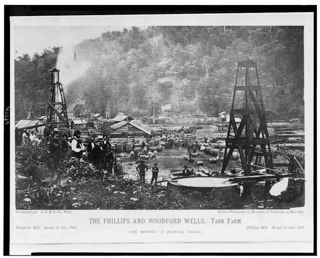This image shows the Woodford oil well with whiskey barrels beside it, in 1861.
