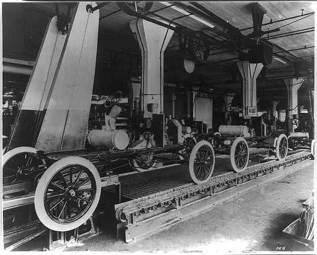 This image shows the assembly line for Ford's Model T.