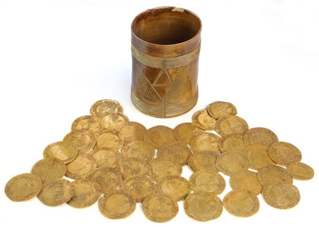 Coins hidden under the kitchen floorboards from the 17th and 18th centuries