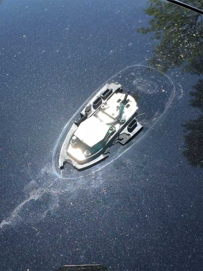 A broken antenna on a car that looks like a sinking ship.